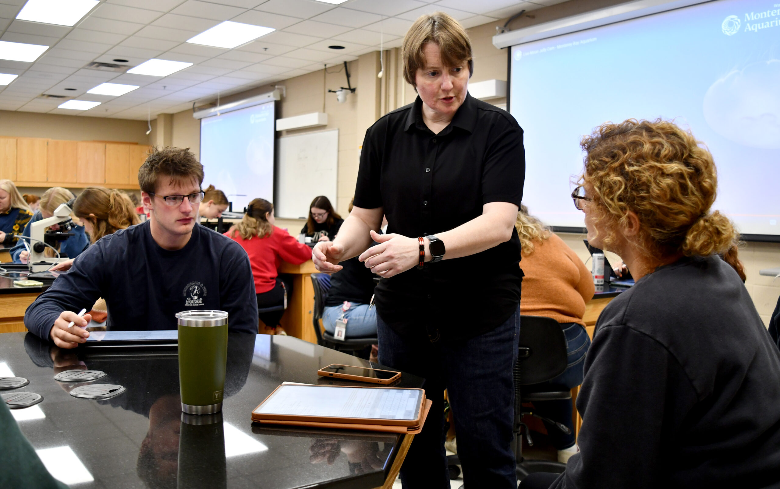 Instructor speaking to student in class