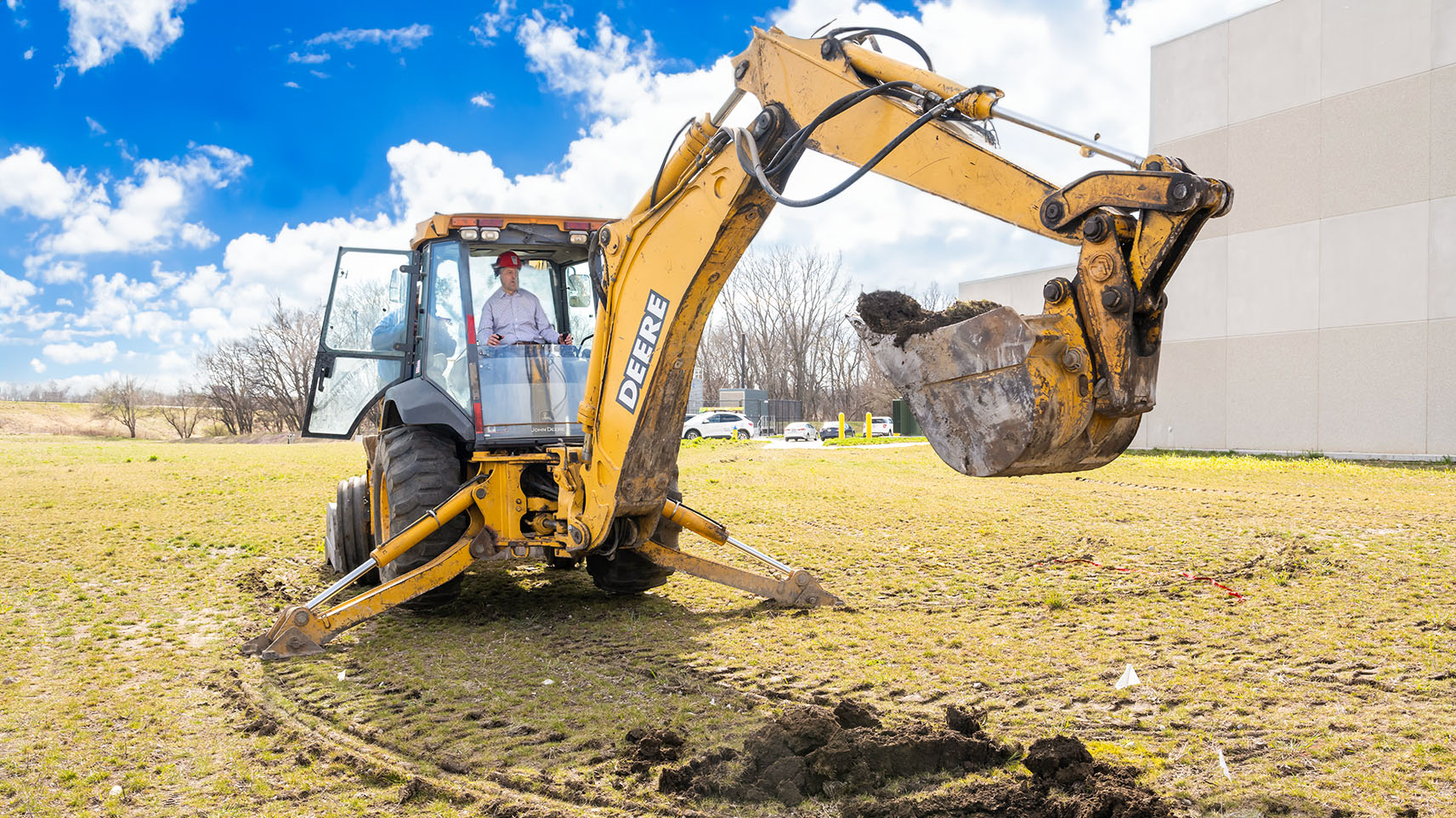 excavator scooping dirt